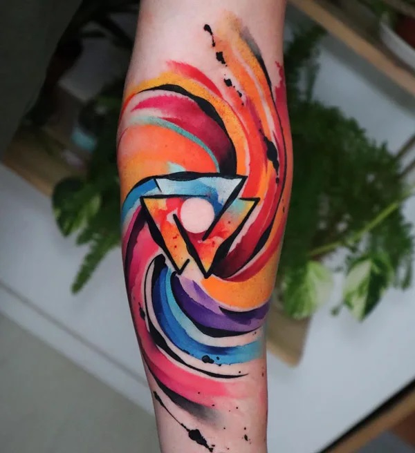 Watercolor Valknut tattoo on forearm