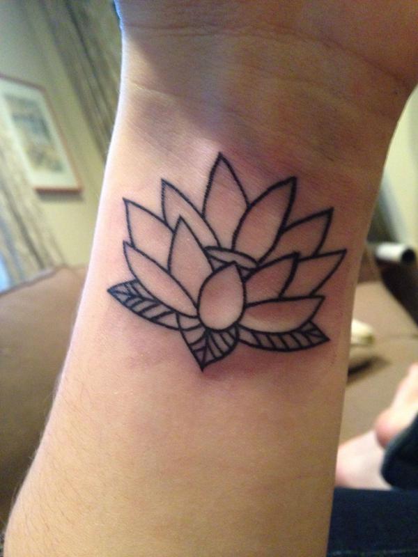 Waterlily line work on the wrist