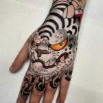 White tiger head hand tattoo
