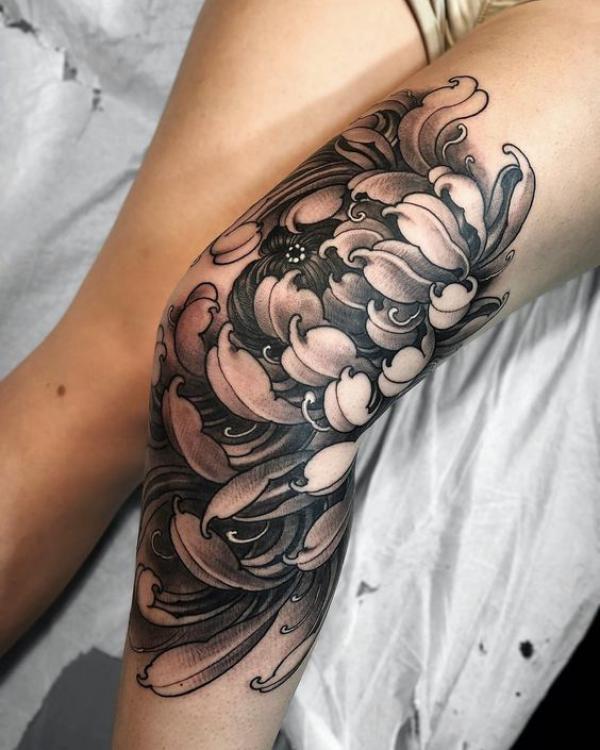 Black and grey Chrysanthemum knee tattoo