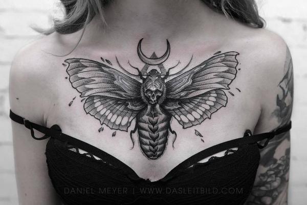 Black and grey death Moth tattoo on chest