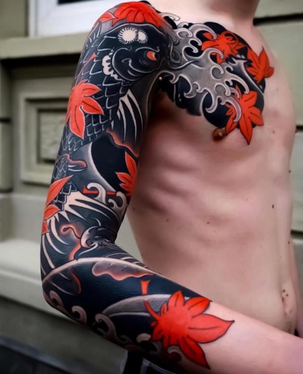 Black koi fish and maple sleeve tattoo
