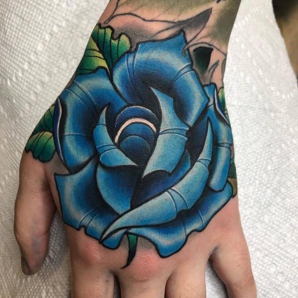Blue rose hand tattoo