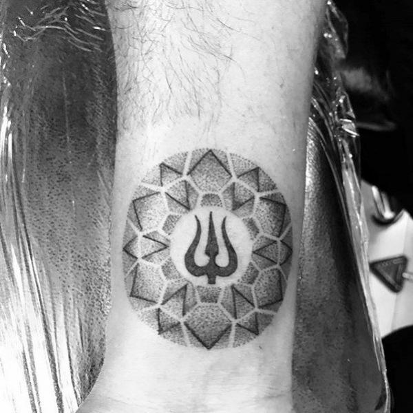 Curcular mandala pattern with a trident in the center