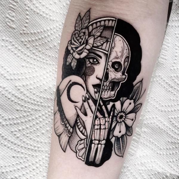 Half face half skull and skeleton hand