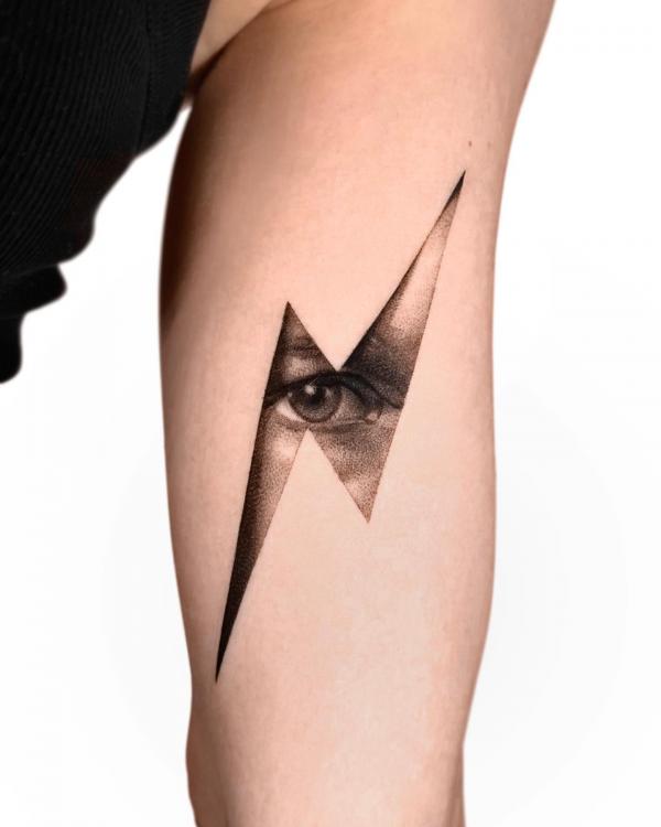 Lightning bolt eye tattoo