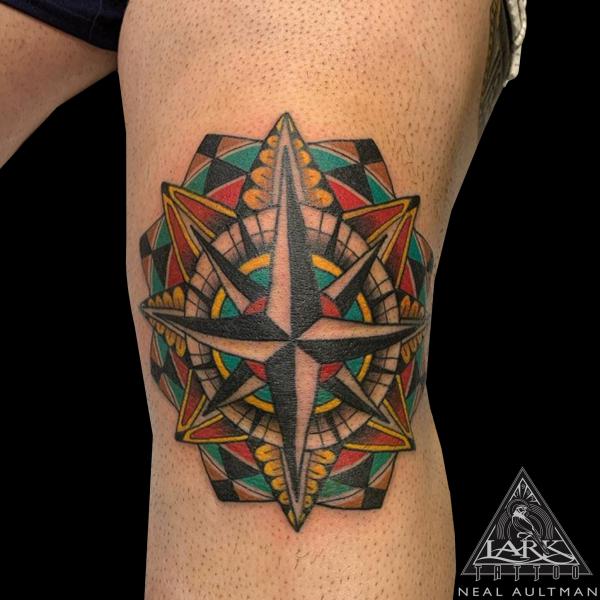 Nautical compass rose knee tattoo
