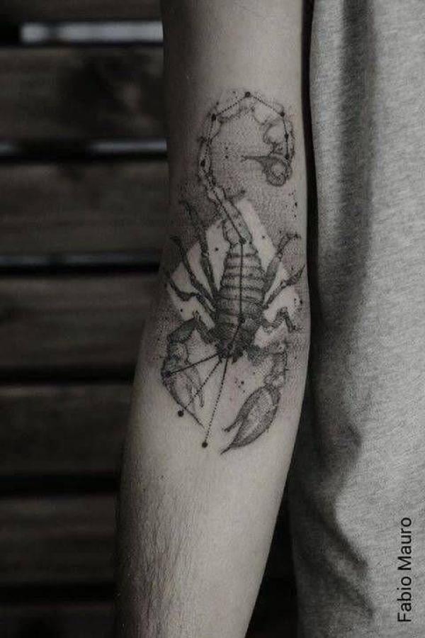 Scorpion tattoo on the inner forearm