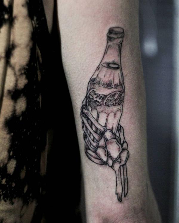 Skeleton hand holding Coca Cola