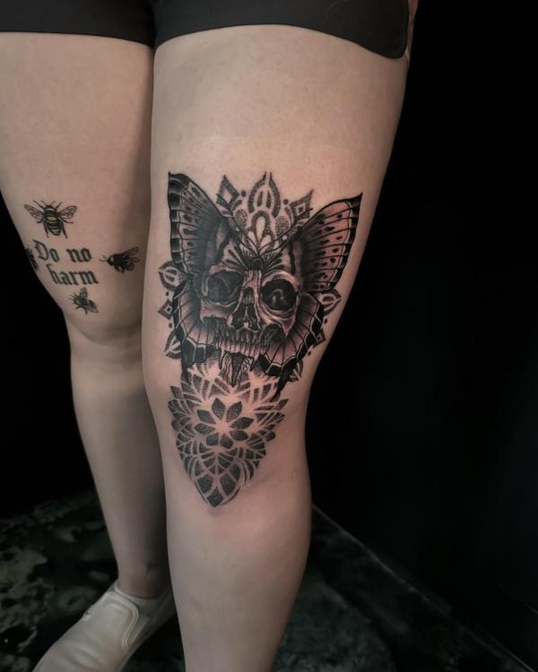 Skull butterfly tattoo