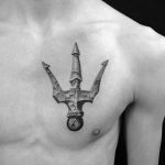 Stone 3D trident chest tattoo
