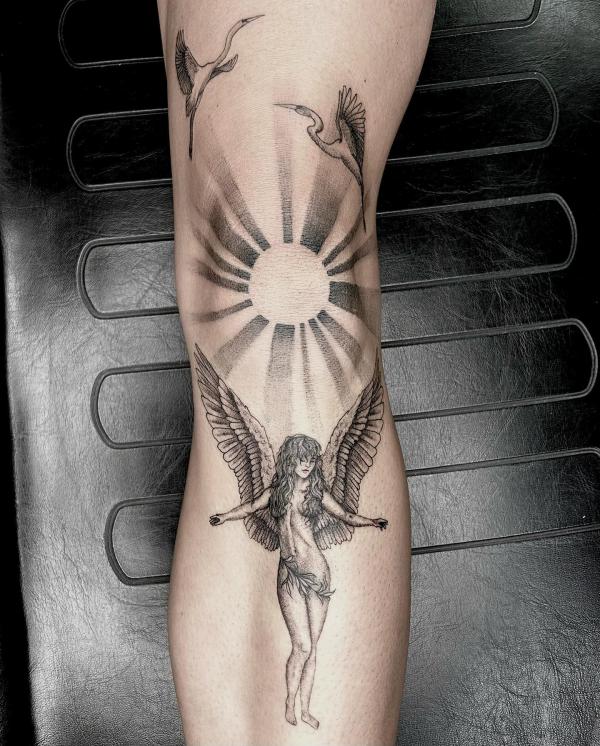 Sun with crane and angel