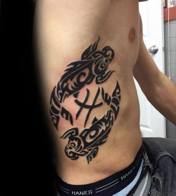 Tribal pisces fish and glyph rib cage tattoo