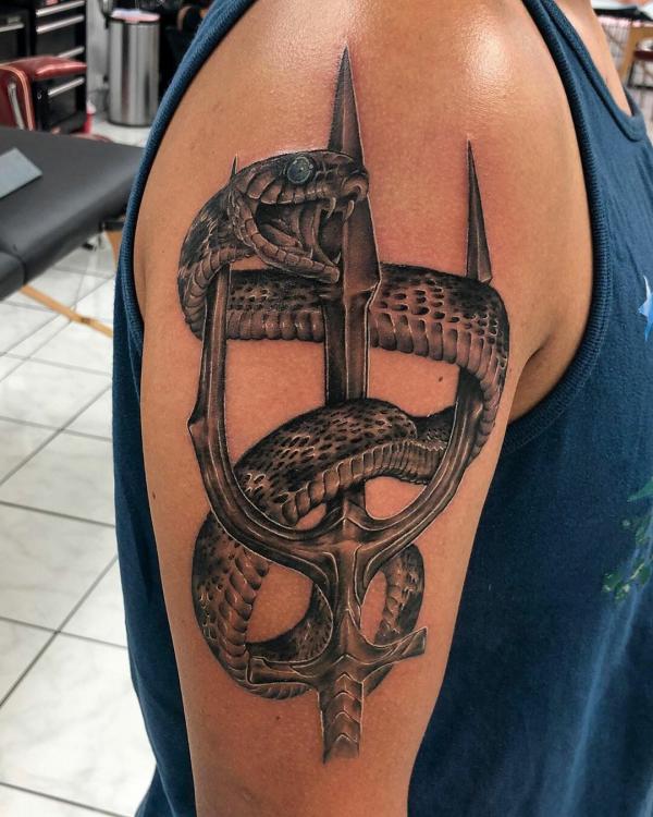 Trident and snake tattoo