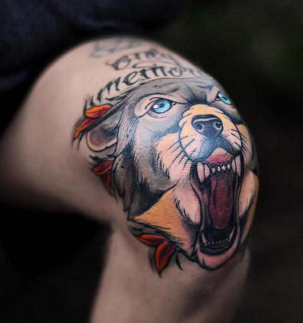 Wolf face knee tattoo