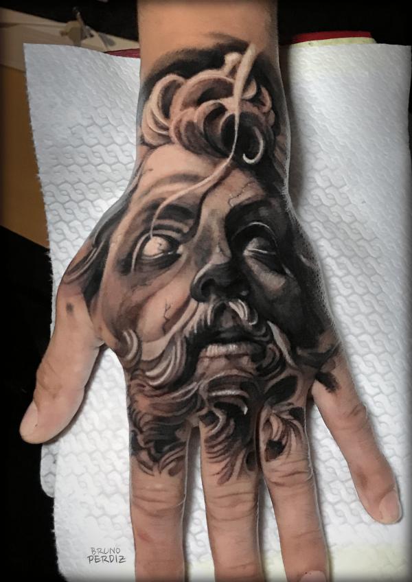 Zeus hand tattoo