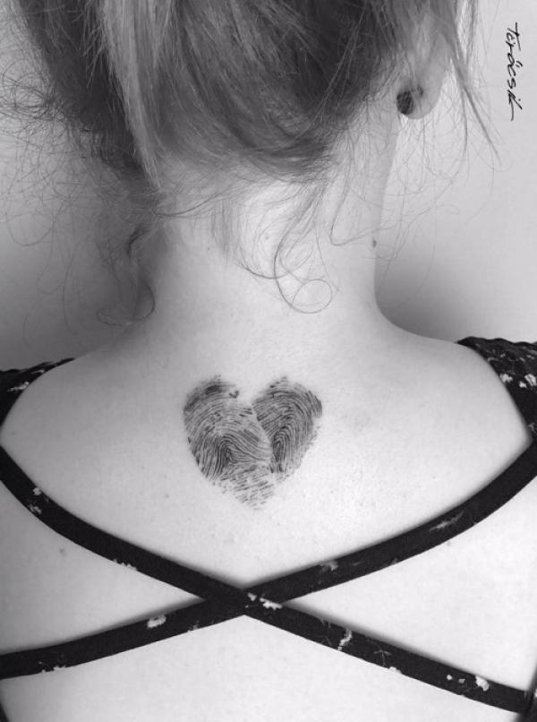 fingerprint heart neck tattoo