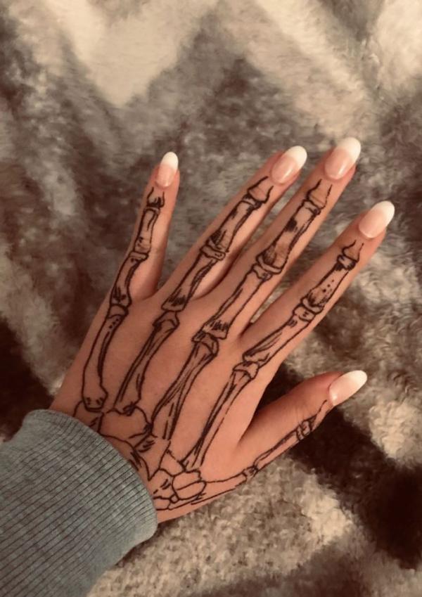 60 Skeleton Hand Tattoo Ideas with Meaning