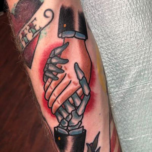 Candle And Hand Skeleton Tattoo On Elbow