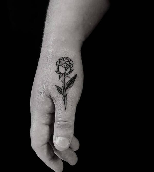 small rose hand tattoo