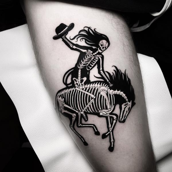 A female skeleton riding on a horse skeleton