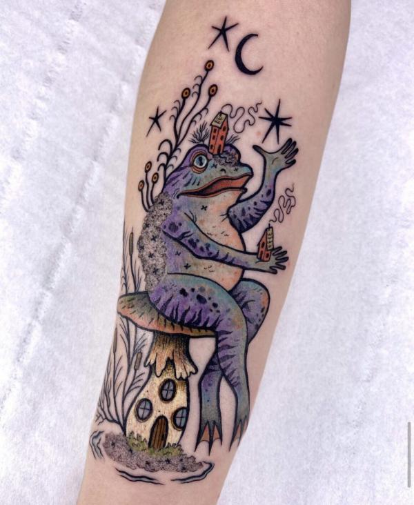 A frog sitting on a mushroom under moon and stars