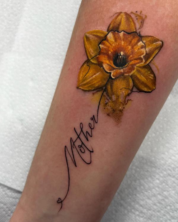 A vintage daffodil tattoo with word Mother