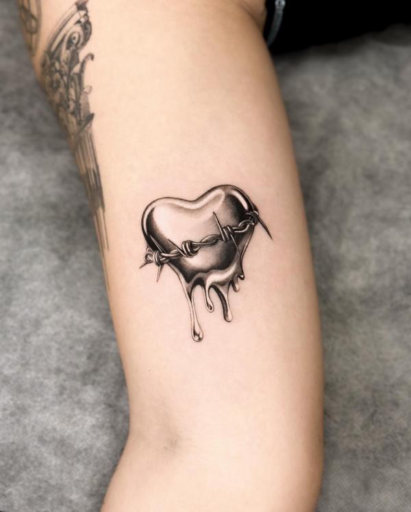 Barbed wire melting heart