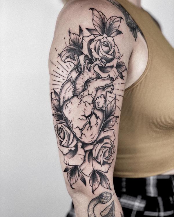 Black and grey heart and rose half sleeve tattoo