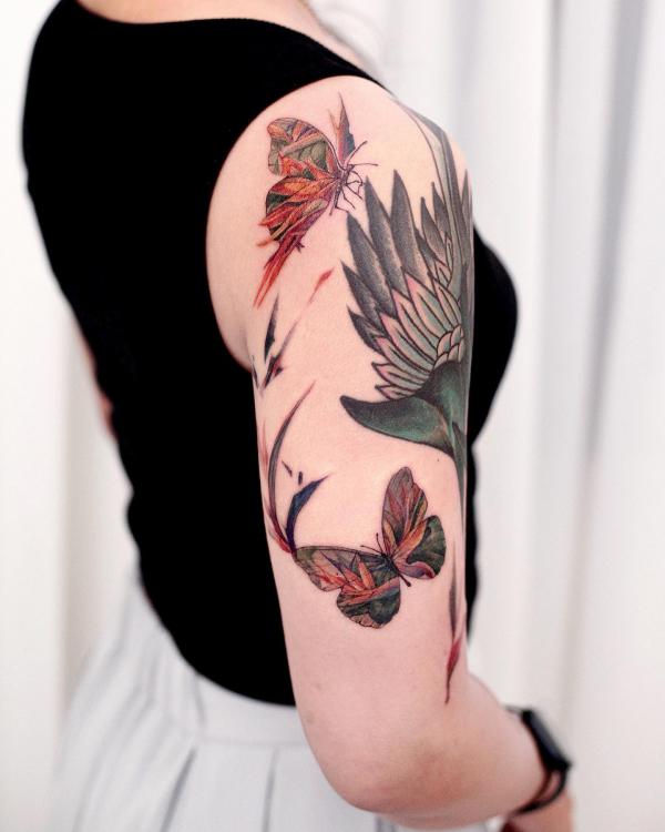 Butterfly and bird of paradise tattoo