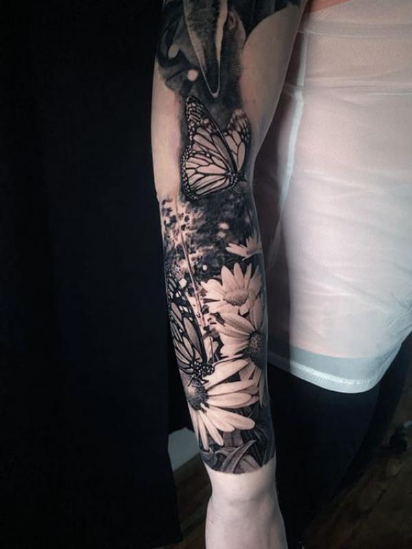 Butterfly and daisy tattoo