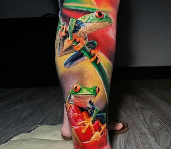 Colorful frog lower leg tattoo
