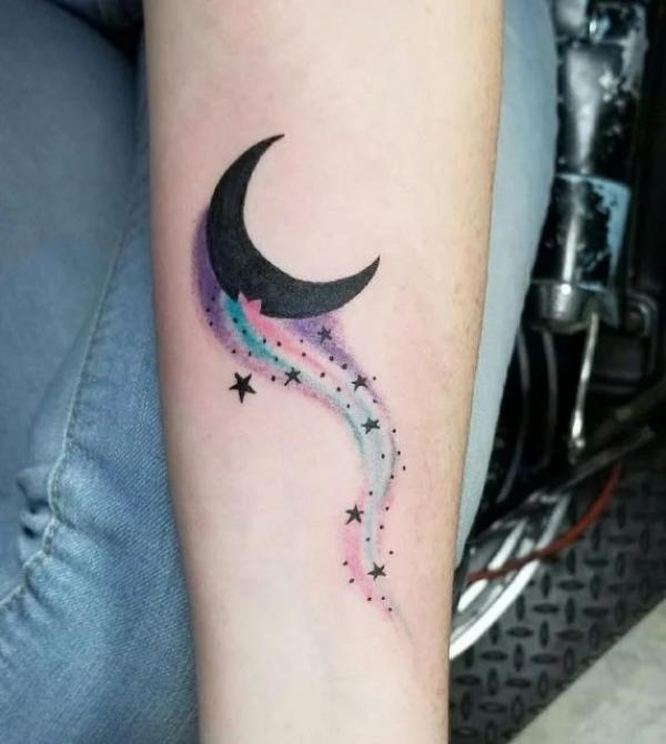 Colorful shooting star and black crescent moon