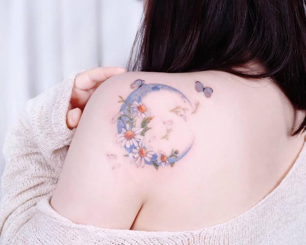Crescent moon with daisy and butterfly