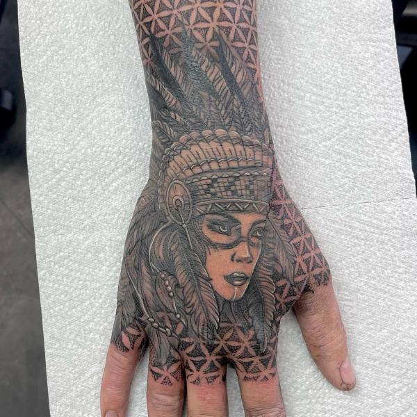 Female native american tattoo with headdress