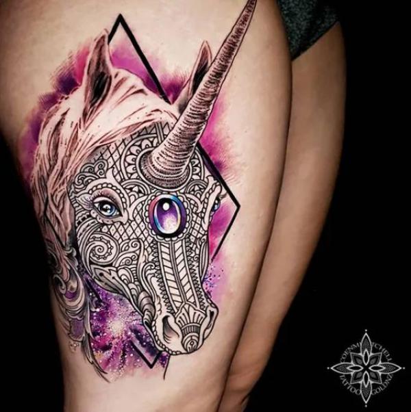 Feminine tribal unicorn tattoo