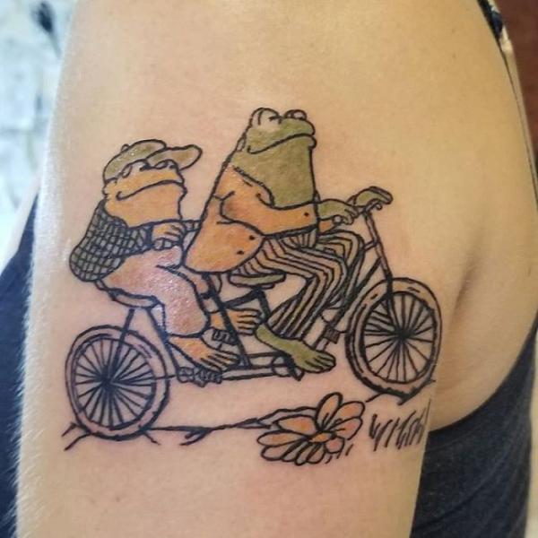 Frog and toad on a bike tattoo