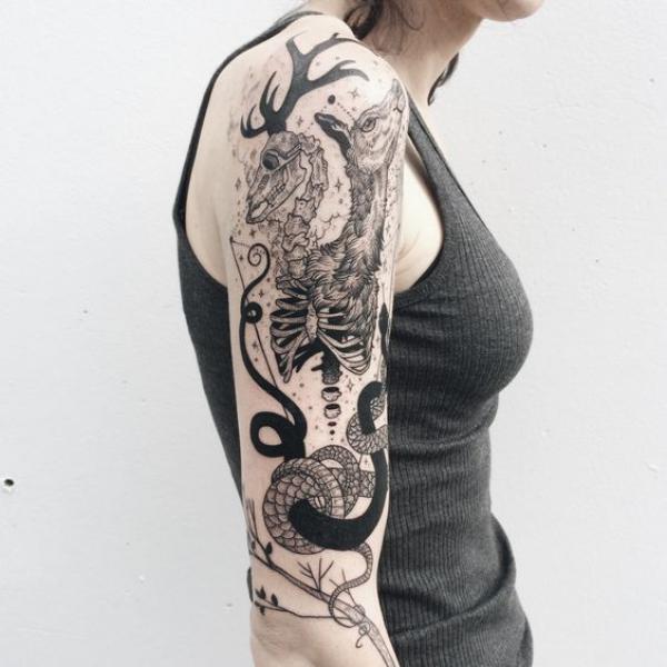 Half deer and half skeleton with snake tattoo