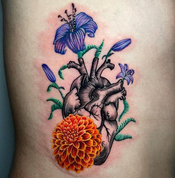 Human heart with lily and Dahlia flowers