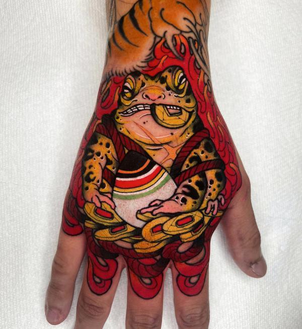 Japanese frog hand tattoo