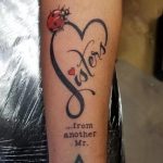 Ladybug on love monogram tattoo for sister