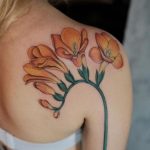 Neo traditional freesia tattoo