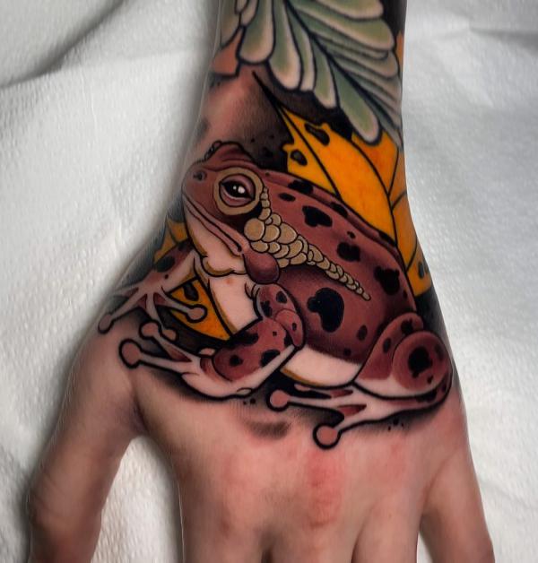 Neo traditional frog hand tattoo
