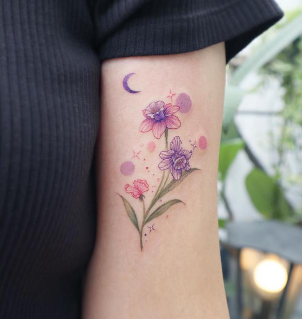 Pink and purple daffodils with moon and stars