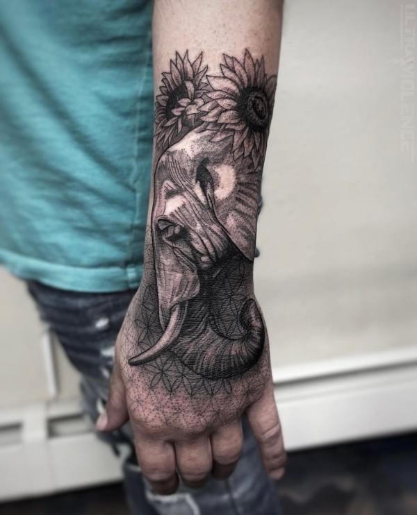 Realistic elephant head on flower of life adorned with sunflowers