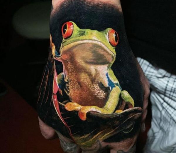Realistic frog hand tattoo
