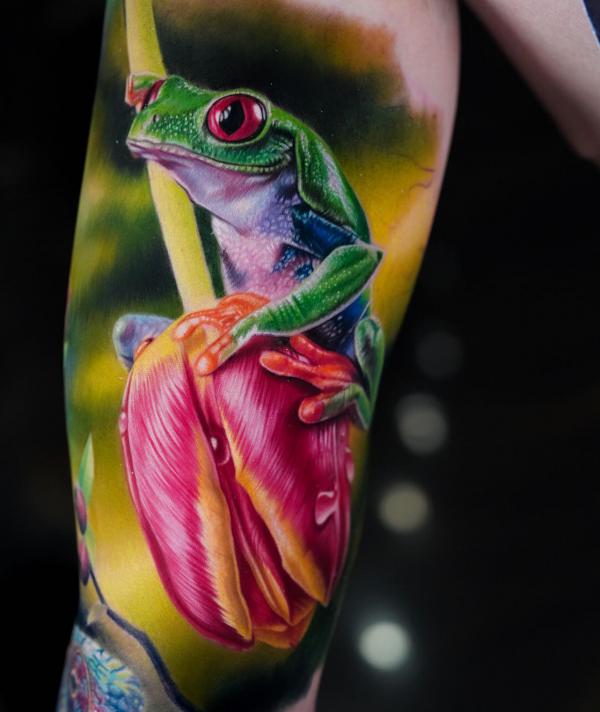 Realistic tulip and frog tattoo