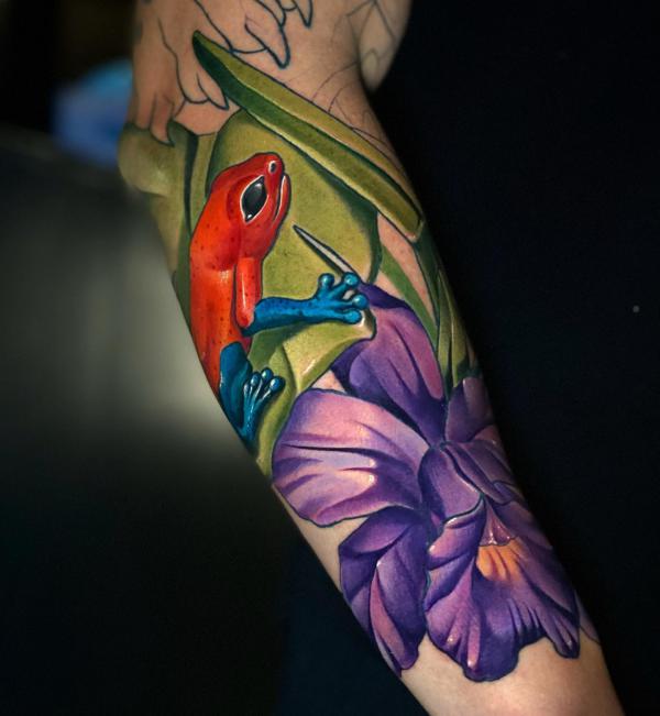 Red frog and purple flower