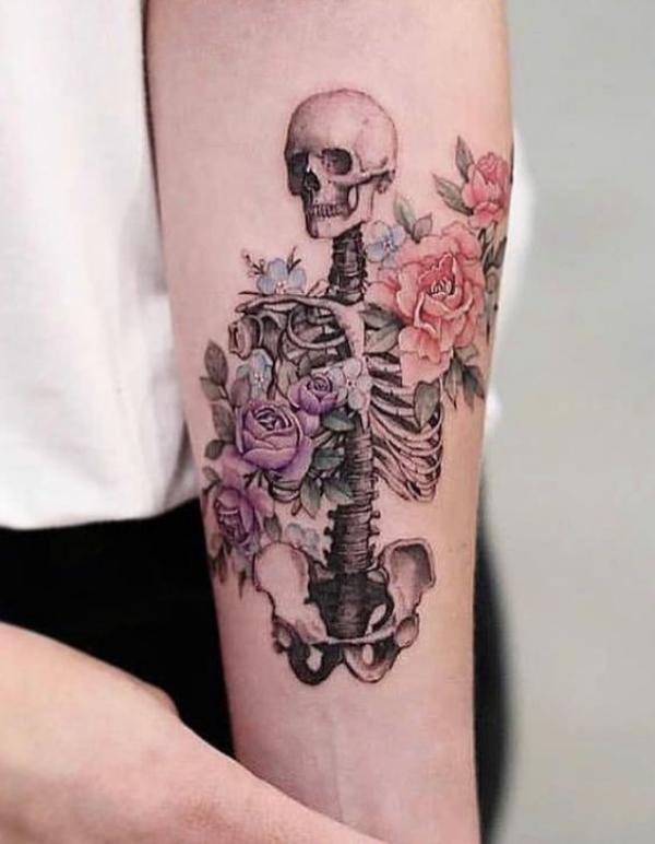 Skeleton adorned with peony flowers