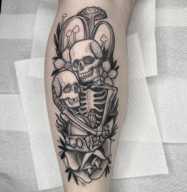 Skeleton lovers hugging each other with mushrooms